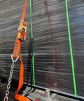 4 Pack 2 Inch Orange Ratchet Straps With Chain Anchors 4000 Lbs WLL securing a black load on a truck bed