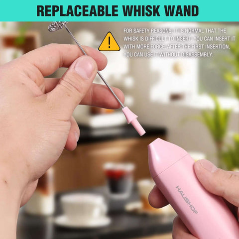Person holding Powerful Rechargeable Milk Frother Wand With Stand, Handheld Electric Foam Maker For Coffee, detachable whisk.