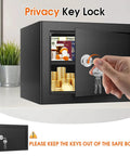 Hand inserting key into 1.3 Cu Ft Fireproof Safe Box With Key Lock For Home And Office, Heavy Duty Steel Security Chest With Removable Shelf