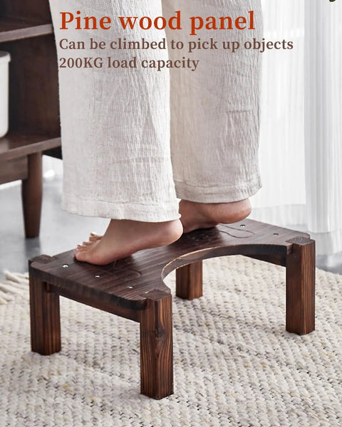 Person standing on pine wood step stool with high load capacity for reaching items