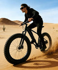 Rider on sandy desert trail using Fat Bike Wheel Set 20 24 26 Inches 4.0 Fat Tires Front Snow Beach Wheel Kit with 135mm Disc Bolt On.