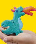 Massive Bulk Modeling Compound With Twelve Four Ounce Cans Packing A Knockout Array Of Jewel Tones Absolutely Perfect For Kid Safe Arts Projects And Creative Crafting Vibes, colorful dragon model in hand.