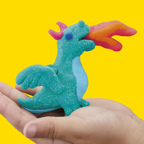 Massive Bulk Modeling Compound With Twelve Four Ounce Cans Packing A Knockout Array Of Jewel Tones Absolutely Perfect For Kid Safe Arts Projects And Creative Crafting Vibes, colorful dragon model in hand.