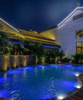 Low Voltage Landscape Well Lights 12W 12 To 24V AC DC In Ground Garden Lights illuminating a poolside at night