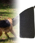 Dog Bite Sleeve Training Gear for Puppies showing safe play with black and white protection sleeve used by puppy in outdoors