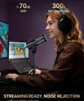 Person using Dual Interface USB XLR Podcast Microphone with Desktop Stand Built Mute Button and Volume Knob Studio Metal Build