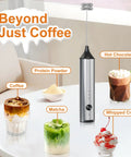 Rechargeable Handheld Milk Frother With Stainless Steel Stand Three Speeds Electric Milk Whisk For Latte And Cappuccino Cordless Coffee Mixer With Type C Charging Easy One Touch Frothing For Barista Quality Drinks on a table with drinks.