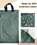 Reusable Hanging Wet Dry Bag Duo For Baby Gear And Travel Needs, Two Zippered Pockets shown with TPU liner and water droplets.