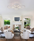 Cool 8-Ring LED Dimmable Ceiling Light With Remote, White Finish, in modern living room setting with white furniture and decor