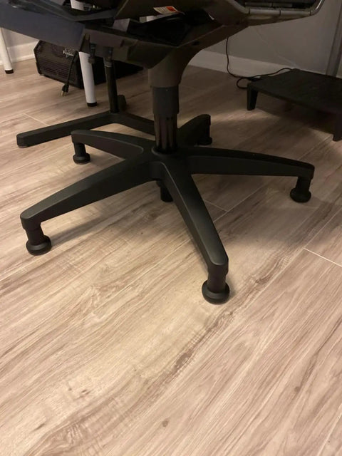 No Slip Bell Glides For Office Chairs And Stools Replacement High Profile Stationary Castor Wheels With Stick On Felt Pads on a chair on wood floor.