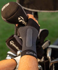 WS6 Compression Wrist Sleeve for Carpal Tunnel Relief, breathable fabric, worn during golf activity, provides steady wrist support.