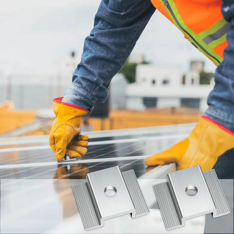 Installing 50 Pcs Aluminum Solar Panel Mid Clamps 1.06 Inch For Roof Mounts, worker securing panel with silver clamps