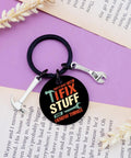 Keychain Gift For Men I Fix Stuff And I Know Things Ideal Dad Gift For Mechanic Handyman on book page with wrench charm