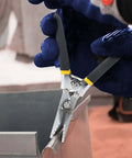 Sheet Metal Seamer Pliers With Non Slip Grip in use, featuring curved jaw and 1/4 inch bend for metal fabrication and roofing projects.