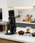 Straight Premium 48mm Conical Burr Coffee Grinder with Stepless Micro Adjustments on kitchen countertop with coffee beans.