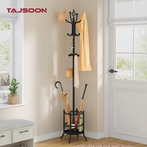 Black Coat Rack Stand With Umbrella Holder Freestanding 16 Hook Coat Tree in corner of room holding hats, umbrellas, and bags.