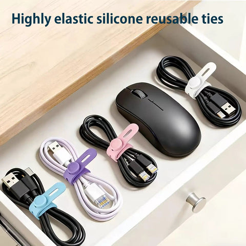 Ultimate 76 Piece Cable Organizer Set with silicone ties securing various cables in a drawer near a mouse