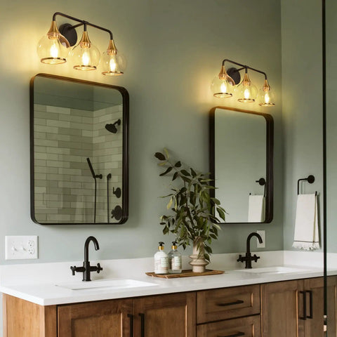 Black And Gold 3 Light Vanity Light Fixture Over Mirror With Clear Glass Shade For Bathroom, wall-mounted above mirrors.