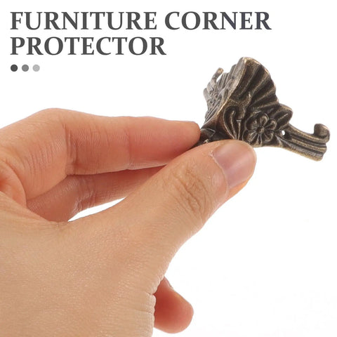 Hand holding furniture corner protector from 8 Pack Vintage Furniture Feet Set For Antique Boxes And Furniture Zinc Alloy Sturdy And Easy To Install