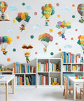 Colorful Hot Air Balloon Wall Decal Set For Classrooms And Playrooms With Flying Book Quote Stickers on a library wall