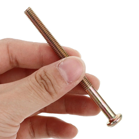 Hand holding copper alloy bolt from Bulletproof Furniture Connector Bolts And Nuts Kit With Hex Socket Heads Copper Alloy Fasteners For Headboards And Crib Repair Heavy Duty Wood Screws Set For Long Lasting Strength And Easy Assembly