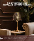 Table lamp with clip-on lampshade on brass base; natural tree design, setting in classic room with armchair and plants.