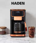Heavy Duty 12 Cup Dual Brew Coffee Maker Built For Hot And Cold Brewing Keep Warm Plate Delay Timer And Adjustable Strength For Seriously Smooth Daily Sips In Sleek Black with glass of iced coffee