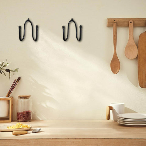 Wall-mounted view of Five Pack Rolling Pin Holder Rack With No Punch Mounting, rustic black metal, kitchen setting with decor