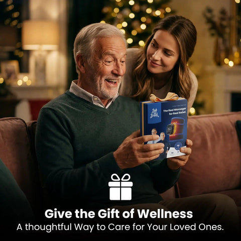 Joyful elderly man receiving an Infrared Heated Wrist Wrap With Vibration Massage for Carpal Tunnel and Arthritis gift from a young woman.