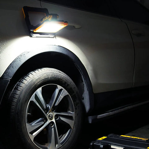 Cordless LED Work Light Compatible With Dewalt And Milwaukee 18V 20V Batteries illuminating car wheel at night