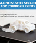 Dual Tool 3D Printer Scraper Set With Angled Metal Spatula removing a 3D-printed car from a printer bed, highlighting metal scraper use.