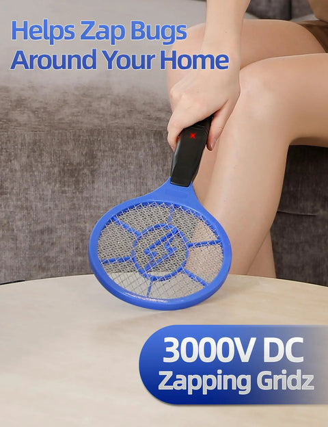 Two Pack Electric Fly Swatter Set Yellow And Blue High Voltage Bug Zapper With Safety Mesh For Indoor And Outdoor Use Mosquito Killer Battery Powered Requires AA Batteries Not Included No More Buzzing held by person indoors.