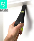 Badass Heavy Duty Padded Door Anchor For Resistance Bands And Suspension Training Rock Solid Gym Hook showing a hand gripping the 1.5 inch wide strap.