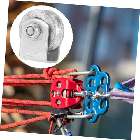 Heavy-duty cast iron sliding gate pulley with colorful ropes and climbing hardware for smooth operation.