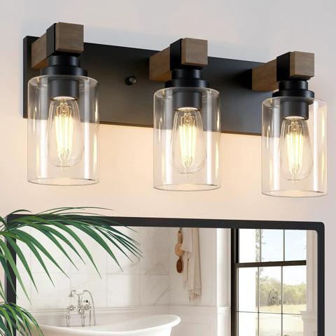 Give Your Mirror Space A Major Glow Up With This Three Bulb Bathroom Vanity Light In Matte Black And Raw Wood Grain Secured By Rock Solid Steel Mounts For Straight Up Rustic Charm, showcasing three glass bulbs.