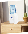 Tabletop Water Dispenser Cooler for Home Office and Outdoor Use on a wooden countertop with a cactus plant beside it