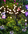 Solar Powered Firefly Lights Outdoor 10 Pack Waterproof Garden Pathway Lights With Swaying Stems Warm White LEDs lit in garden