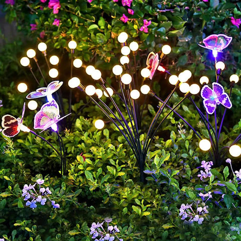 Solar Powered Firefly Lights Outdoor 10 Pack Waterproof Garden Pathway Lights With Swaying Stems Warm White LEDs lit in garden