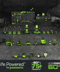 Various green and black power tools and equipment displayed in a room, showcasing Greenworks' 60V ULTRAPOWER product range.
