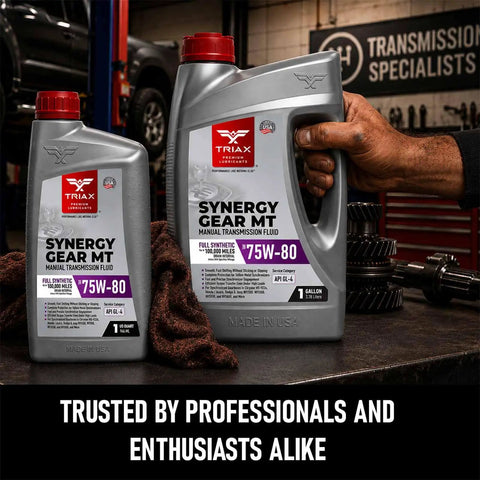 Synergy Gear MT 75W-80 GL-4 Full Synthetic Manual Transmission Fluid one gallon bottle on workshop table with gears in background