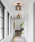 Hallway with installed Farmhouse Pendant Lights 2 Pack Modern Black Hanging Light Fixtures with Hexagonal Cage ceiling lights.