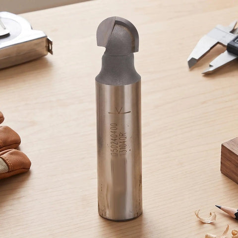 Premium 1/2 Inch Shank Cove Box Router Bit With Round Bottom Tungsten Carbide Woodworking Cutter For CNC And Auto Machining Centers on workbench.