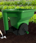 Hand Crank Garden Spreader For Lawn Care No Power Needed Seed And Fertilizer Applicator in ABS and PP, shown in lettuce rows