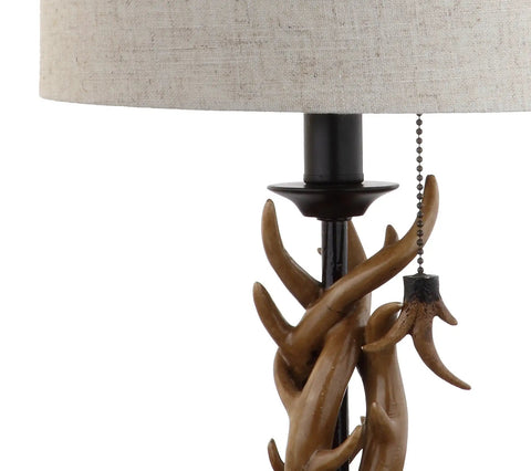 Close-up of Brown Rustic Antler Table Lamp For Bedroom And Lodge Cabin Decor, faux antler base, gray linen shade, pull chain detail.