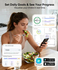 Woman using phone to sync with Smart Nutrition Scale For Real Foodies Tracks Calories Fat Carbs And Protein With TFT Display.