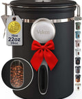 Airtight Stainless Steel Coffee Canister With Window 22 oz, black canister with red bow and side window displaying coffee beans.