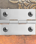 Close-up of 30 Pieces Stainless Steel 2 Inch Cabinet Door Hinges Set For Furniture And Cabinets Durable Rust Resistant Silver Metal Home Hardware With Screws For Easy DIY Installation And Long Lasting Performance.