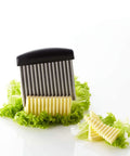 Triangle crinkle cutter with stainless steel blades and black handle; creates julienne, waffle, and wavy cuts.