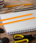 10 Pack HB Carpenter Pencils Yellow Wood With White Eraser Head For Construction Engineering Woodworking Drafting School And Office Use Great For Marking Lines On The Jobsite And Clean Erases On Surfaces on a desk with notebook and scissors