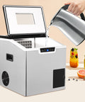 2 in 1 Countertop Ice Maker Crushed Ice and Cube Options Serving Chill with Rock Solid Stainless Steel Build and Smart LCD Screen pouring water.